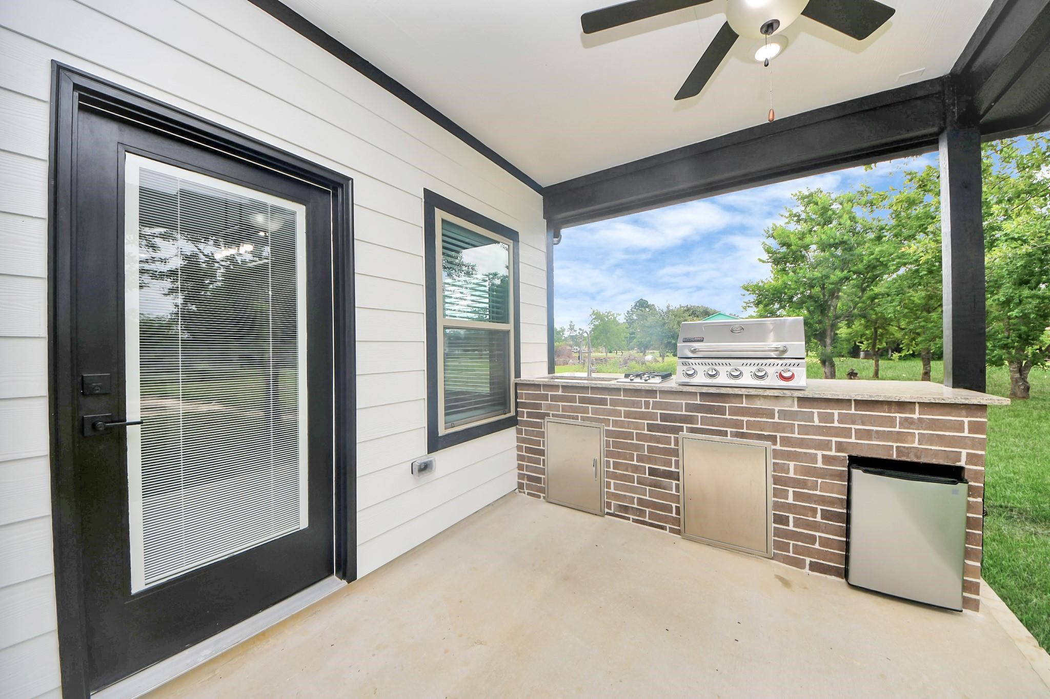 601 Lily Street Prairie View, TX 77484 - Photo 5 of 14 a view of a porch with a floor to ceiling window and wooden floor