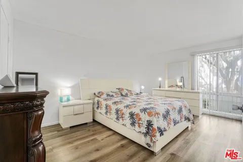 a bedroom with a bed and a fireplace