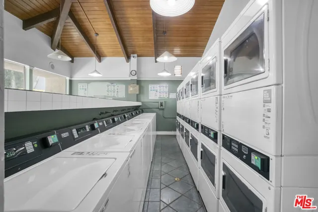 a swimming pool with outdoor seating and garden