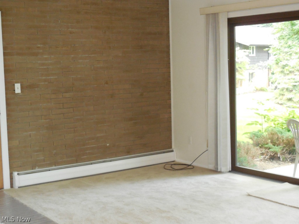 5721 Som Center Road, Unit 21 Solon, OH 44139 - Photo 3 of 11 Living Room with wall to wall carpeting, sliders to Patio with view of Pond