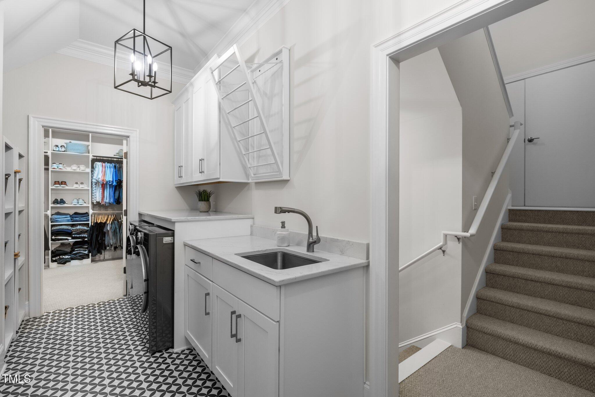 6648 Mafolie Court Raleigh, NC 27613 - Photo 23 of 57 Laundry Rm with sink and storage
