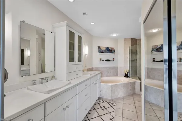 a bathroom with a bathtub and a shower