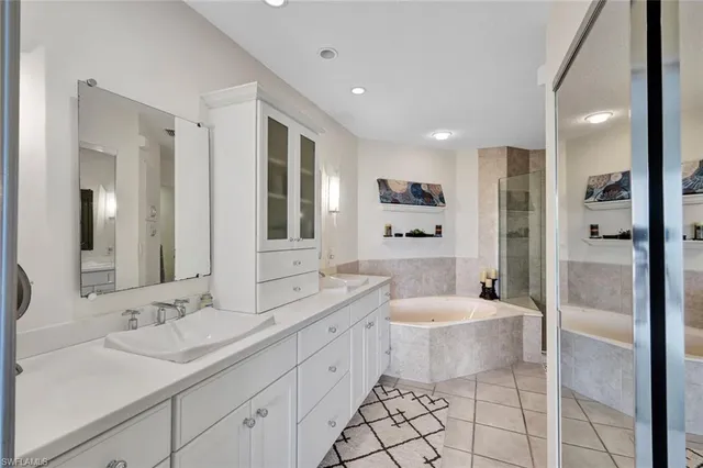 a bathroom with a bathtub and a shower