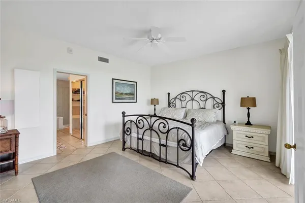 a bedroom with a bed and a table