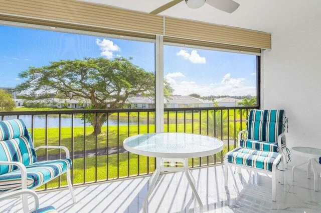 a view of a swimming pool with a lounge chairs