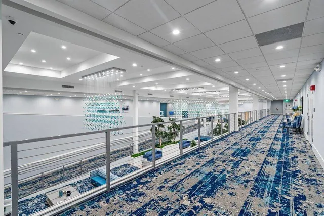 a living room with lots of furniture and a table