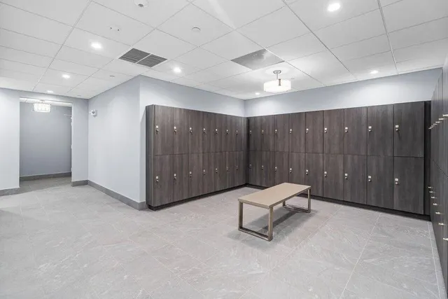 an empty room with table and chairs