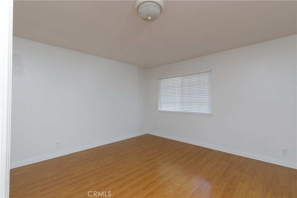14256 Bolsa Chica Road Westminster, CA 92683 - Photo 11 of 15 a view of a room with wooden floor and fan