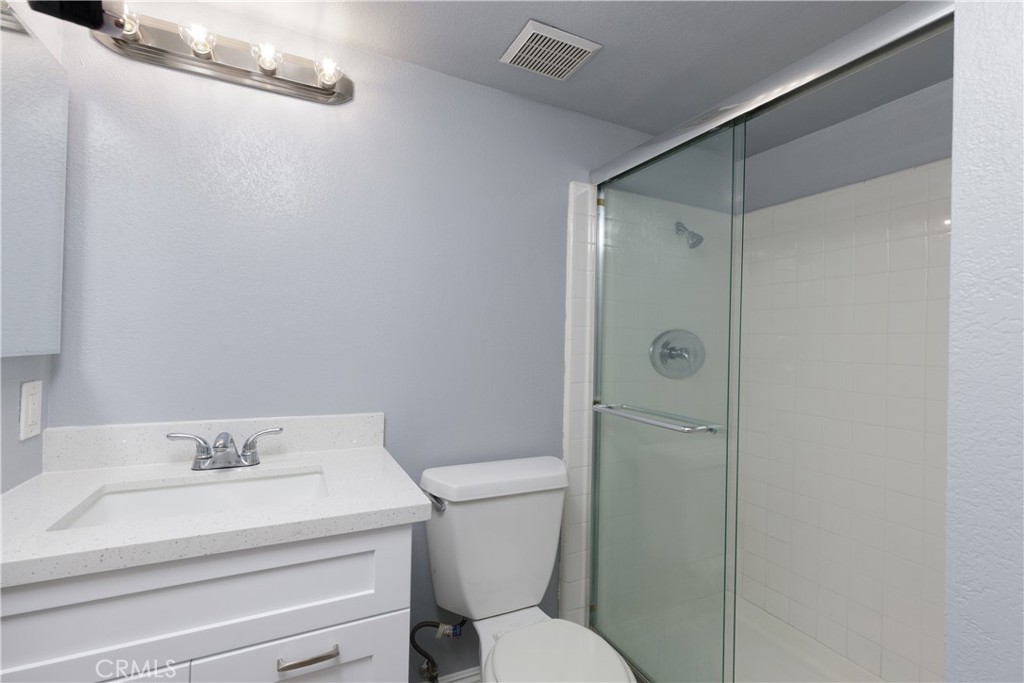 14256 Bolsa Chica Road Westminster, CA 92683 - Photo 4 of 15 a bathroom with a sink toilet and shower