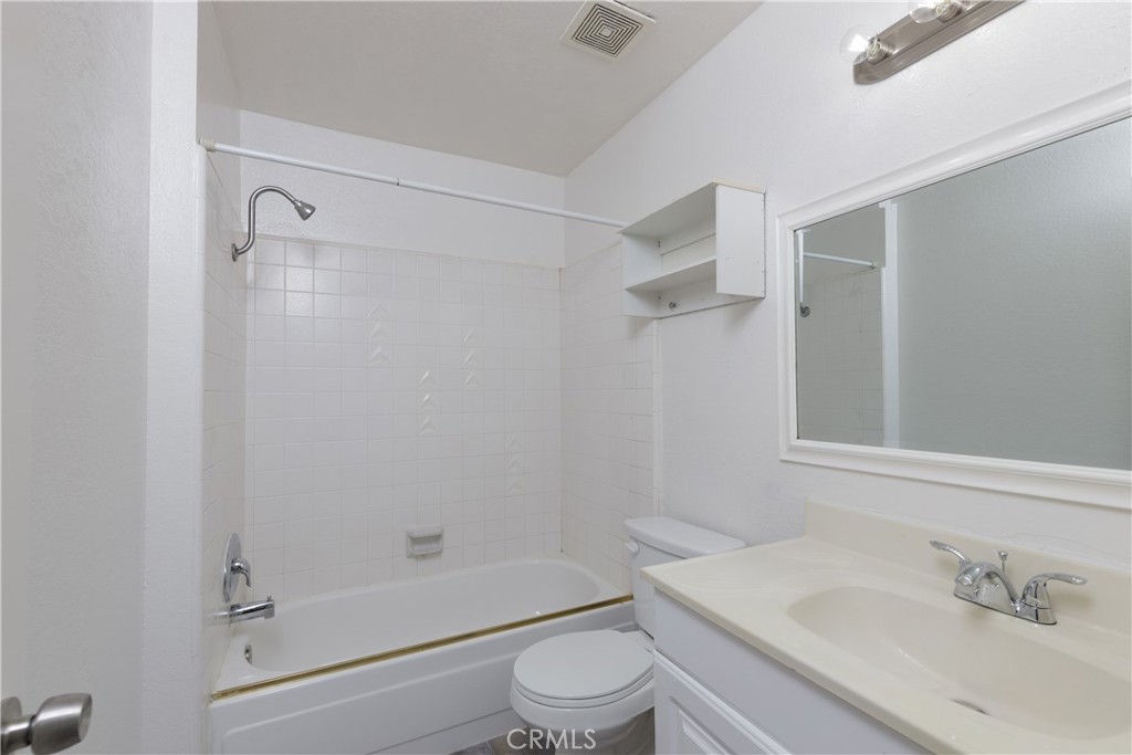 14256 Bolsa Chica Road Westminster, CA 92683 - Photo 8 of 15 a bathroom with a sink toilet and shower