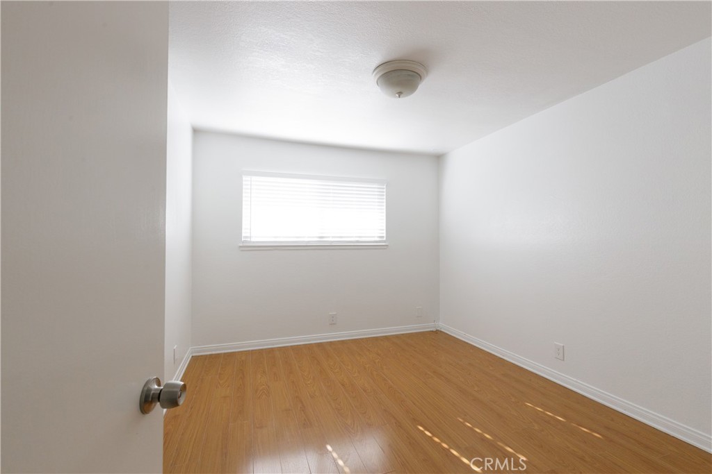 14256 Bolsa Chica Road Westminster, CA 92683 - Photo 9 of 15 an empty room with a window