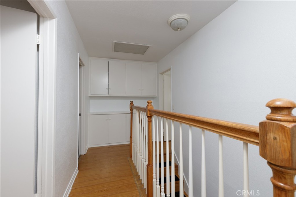 14256 Bolsa Chica Road Westminster, CA 92683 - Photo 10 of 15 a view of a hallway with wooden floor and staircase