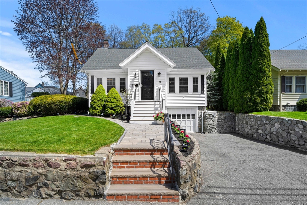 76 Perkins Street Stoneham, MA 02180 - Photo 1 of 40 a front view of a house with garden