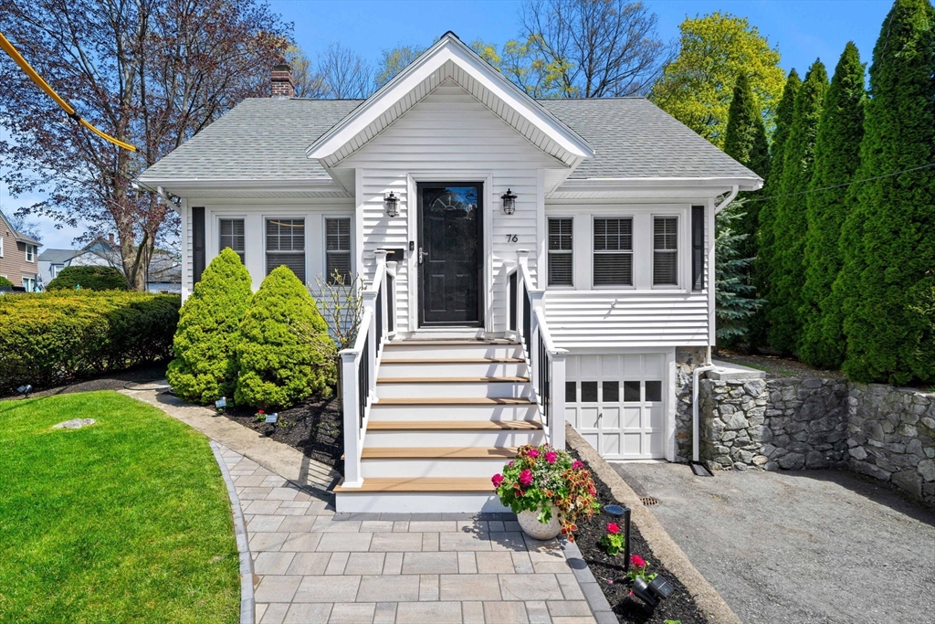 76 Perkins Street Stoneham, MA 02180 - Photo 2 of 40 a front view of a house with a garden