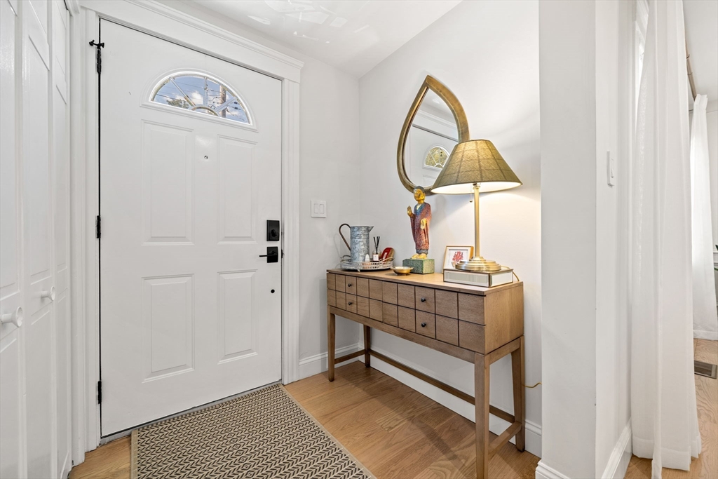 76 Perkins Street Stoneham, MA 02180 - Photo 5 of 40 a room with a mirror and a table
