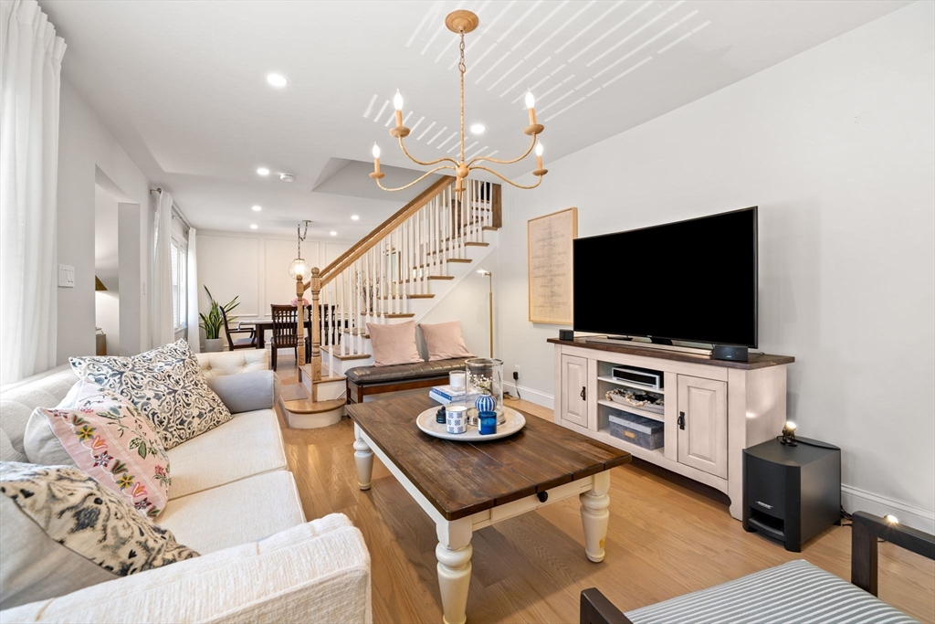76 Perkins Street Stoneham, MA 02180 - Photo 8 of 40 a living room with furniture and a flat screen tv
