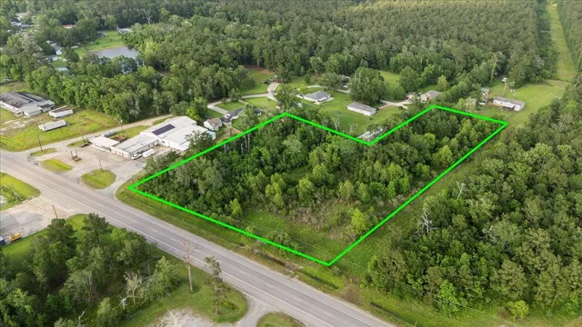 a view of a yard with potted plants