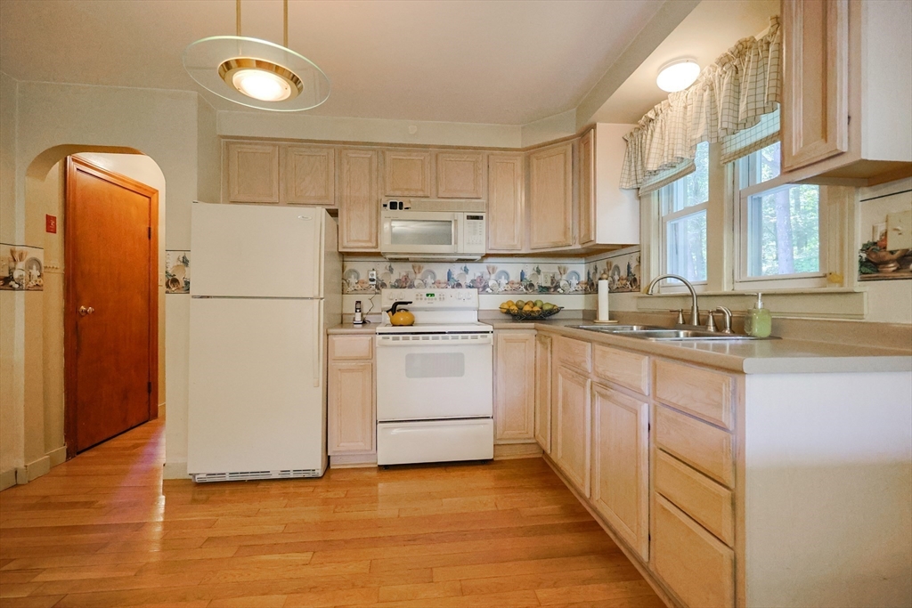 500 Worcester Road Barre, MA 01005 - Photo 11 of 24 a kitchen with white cabinets and white appliances