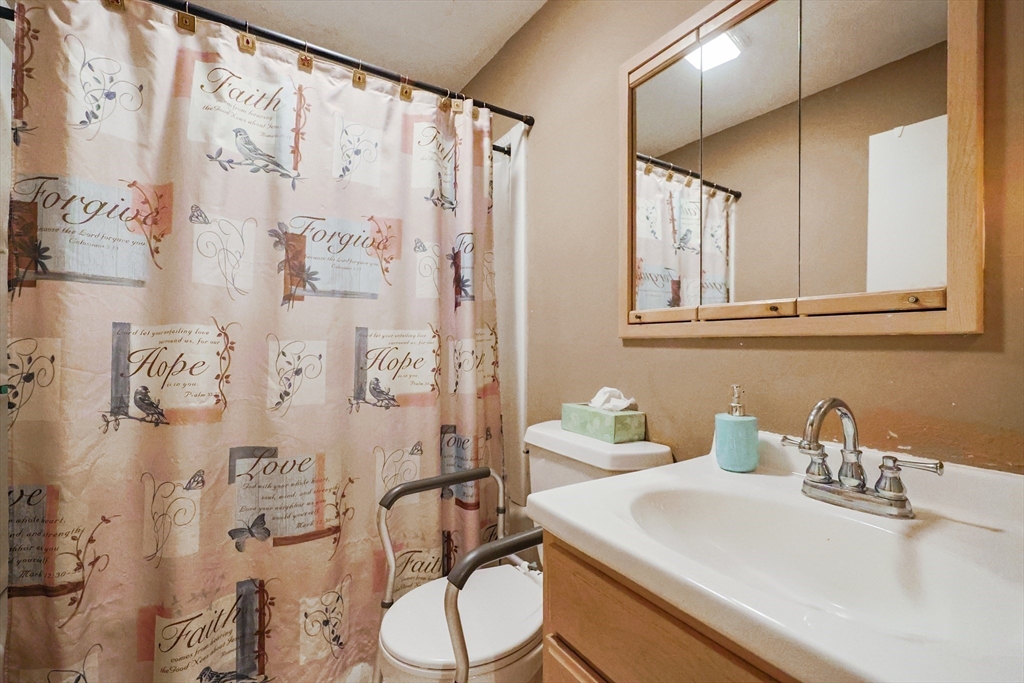 500 Worcester Road Barre, MA 01005 - Photo 13 of 24 a bathroom with a sink vanity mirror and toilet