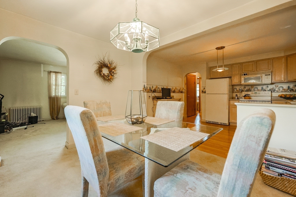 500 Worcester Road Barre, MA 01005 - Photo 9 of 24 a dining room with furniture a chandelier and wooden floor