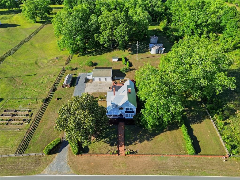 880 Johnstonville Road Barnesville, GA 30204 - Photo 1 of 33 a aerial view of a house with swimming pool