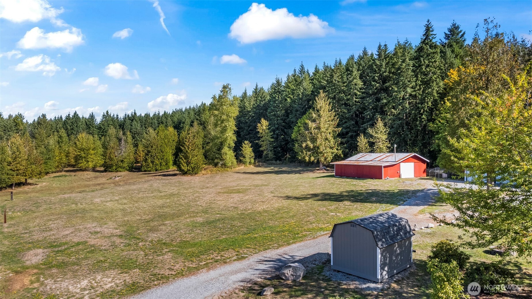 6915 Stringtown Road East Eatonville, WA 98328 - Photo 23 of 40 a view of a yard with an outdoor space