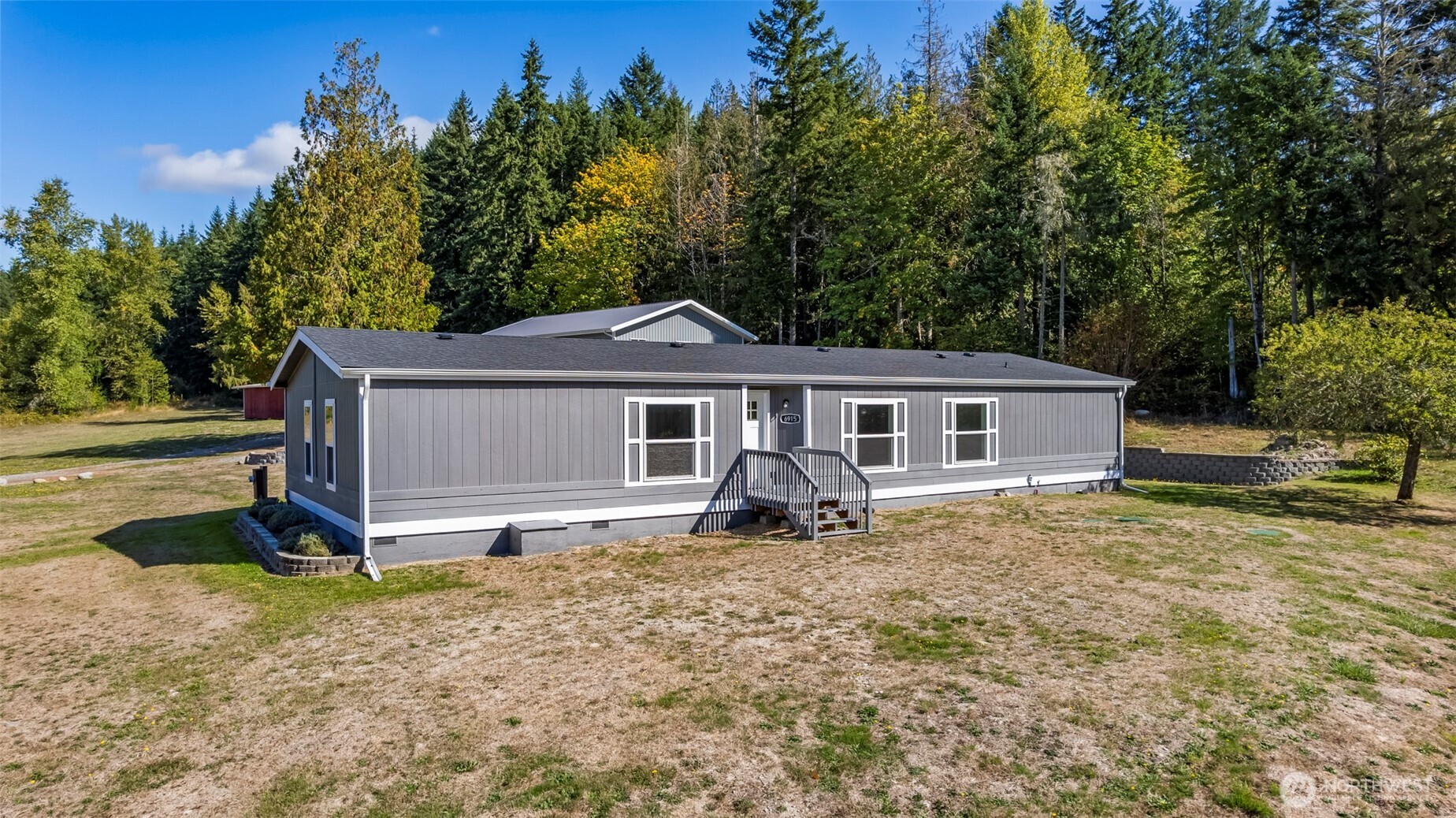 6915 Stringtown Road East Eatonville, WA 98328 - Photo 27 of 40 a front view of a house with yard