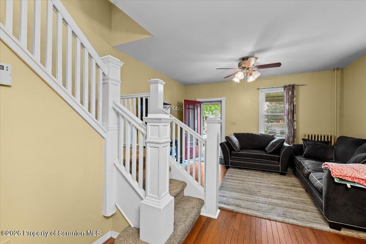 607 Deacon Street Scranton, PA 18509 - Photo 12 of 40 a living room with furniture and a chandelier
