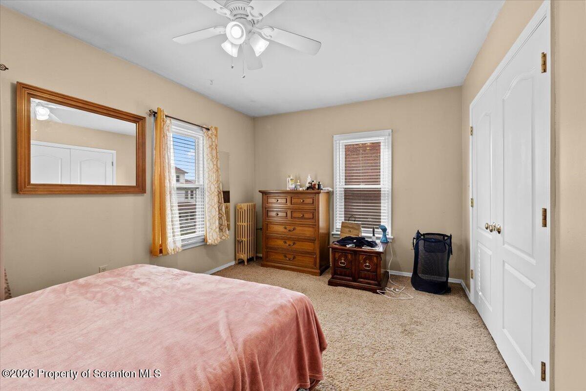 607 Deacon Street Scranton, PA 18509 - Photo 14 of 40 a bedroom with a bed and furniture