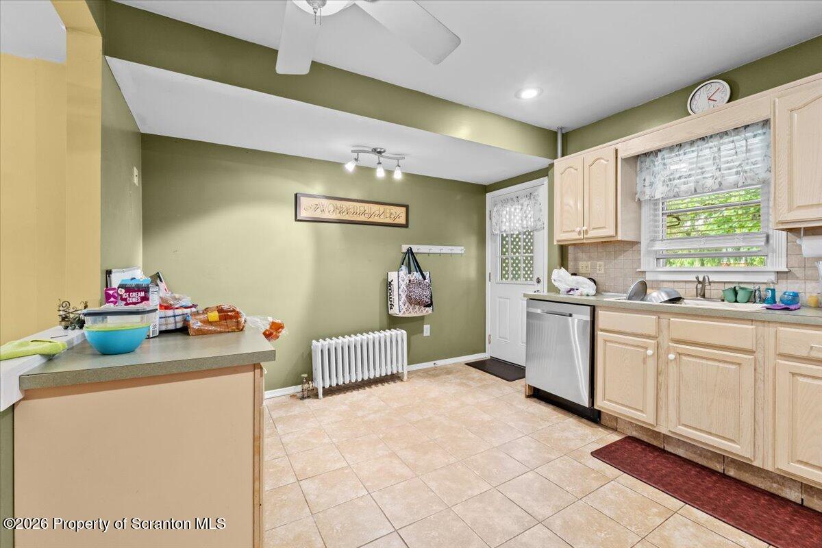 607 Deacon Street Scranton, PA 18509 - Photo 15 of 40 a kitchen with sink cabinets and window