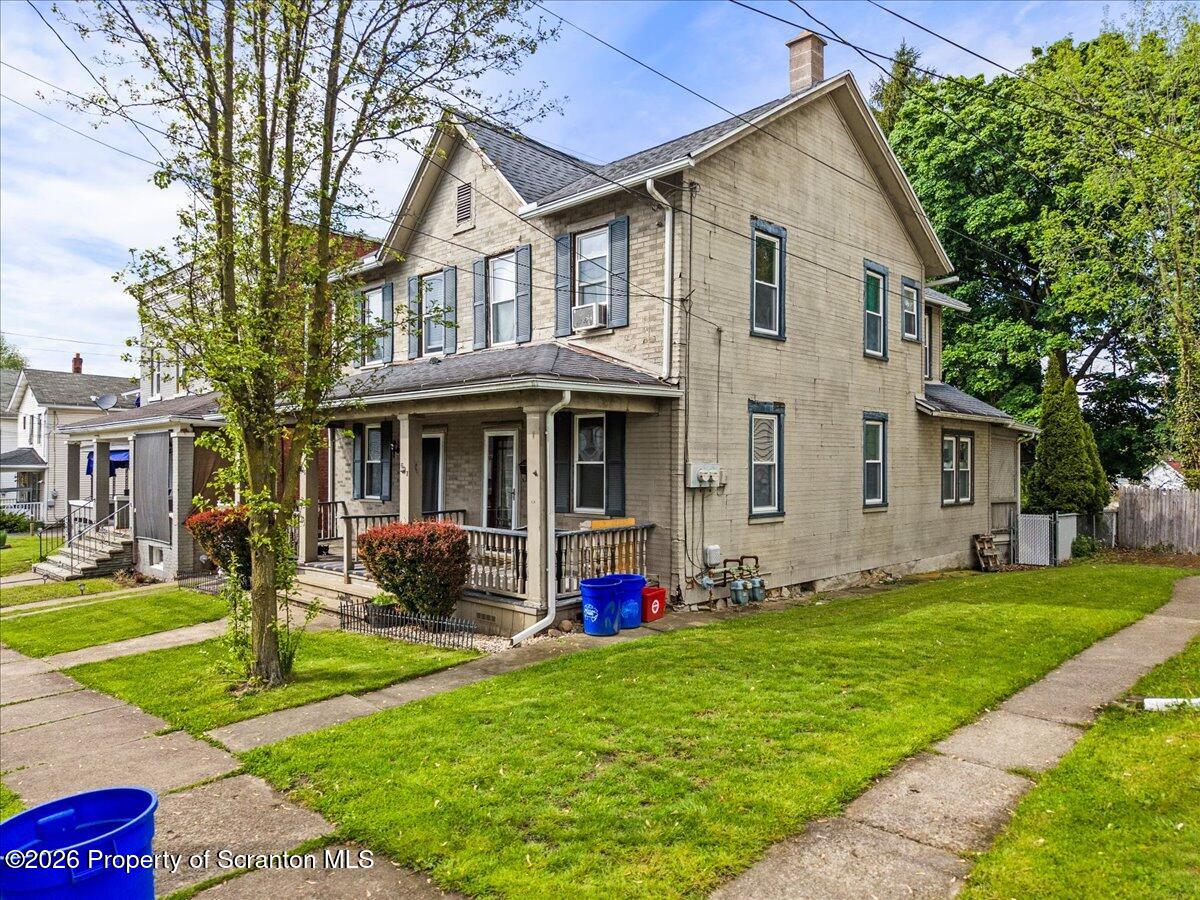 607 Deacon Street Scranton, PA 18509 - Photo 2 of 40 a front view of a house with garden