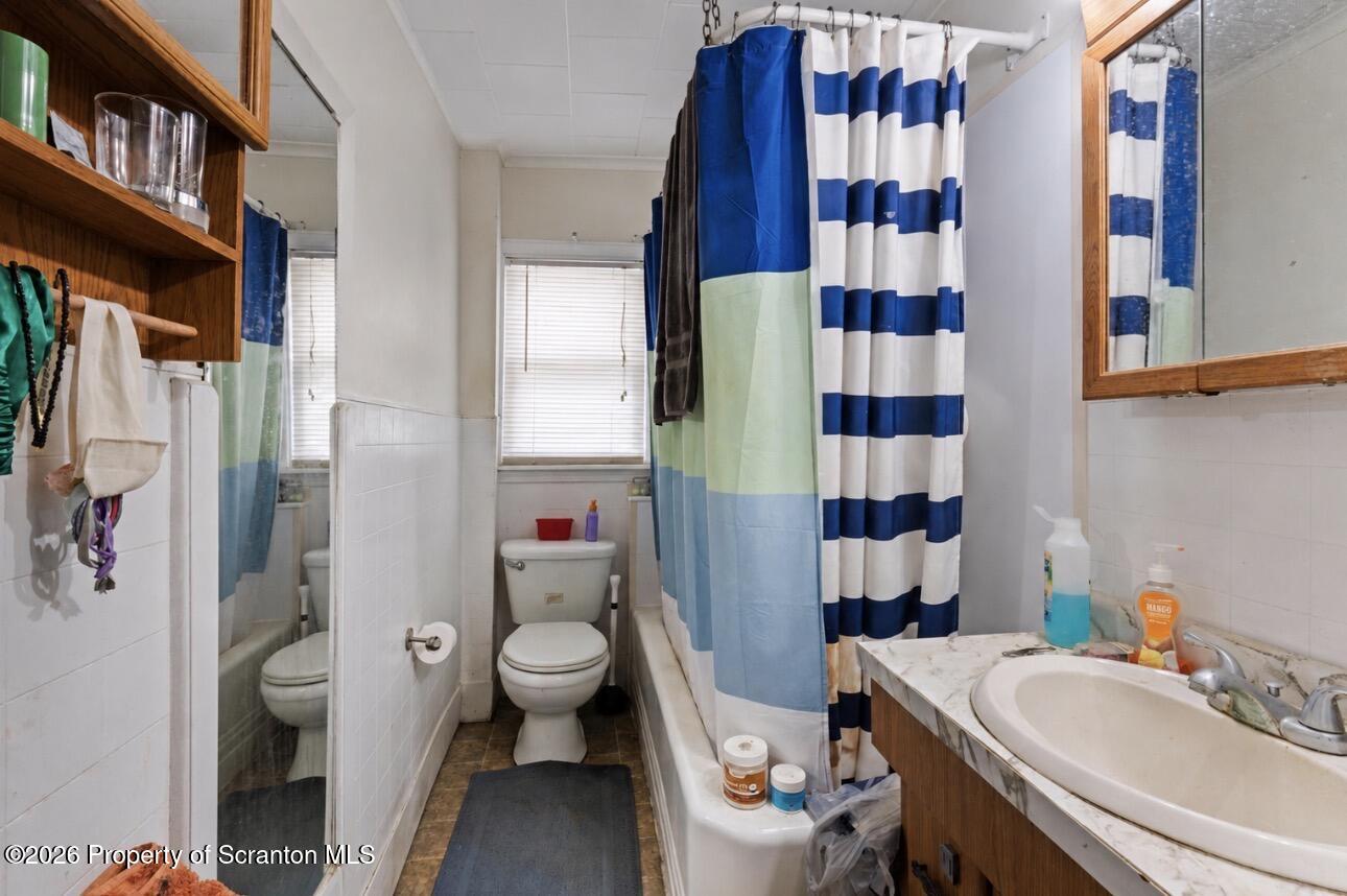 607 Deacon Street Scranton, PA 18509 - Photo 35 of 40 a bathroom with a sink toilet and shower