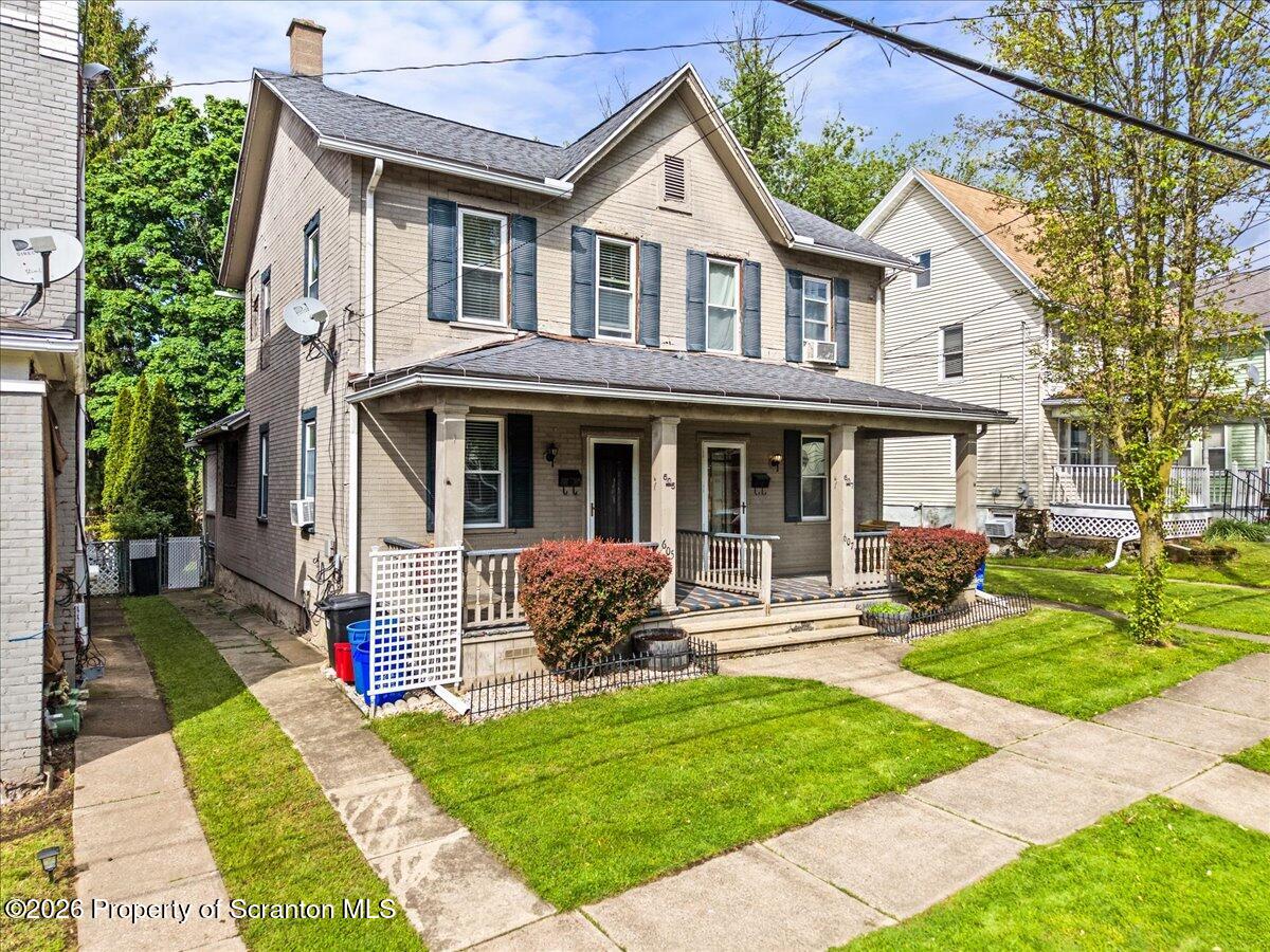 607 Deacon Street Scranton, PA 18509 - Photo 5 of 40 a front view of a house with a yard