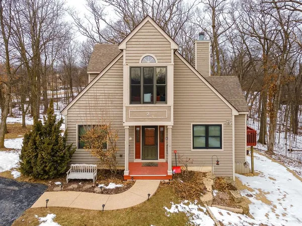 a front view of a house with a porch