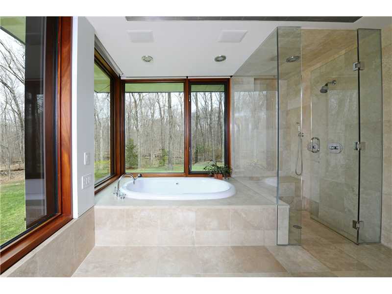 21 Mountain Wood Drive Greenwich, CT 06830 - Photo 12 of 20 a bathroom with a bathtub and shower