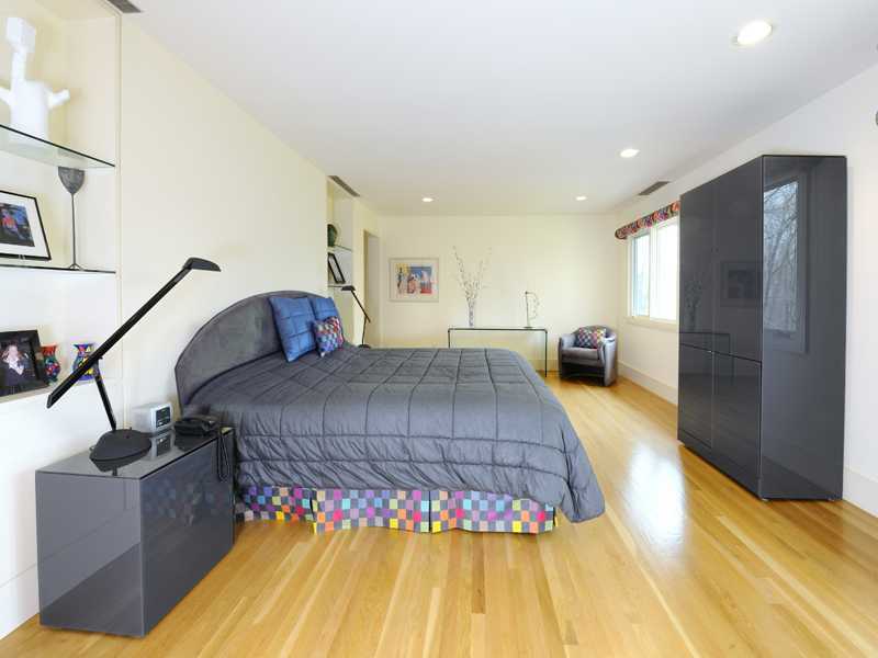 21 Mountain Wood Drive Greenwich, CT 06830 - Photo 14 of 20 a spacious bedroom with a bed and a couch