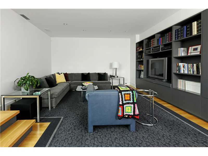 21 Mountain Wood Drive Greenwich, CT 06830 - Photo 17 of 20 a living room with furniture and a book shelf