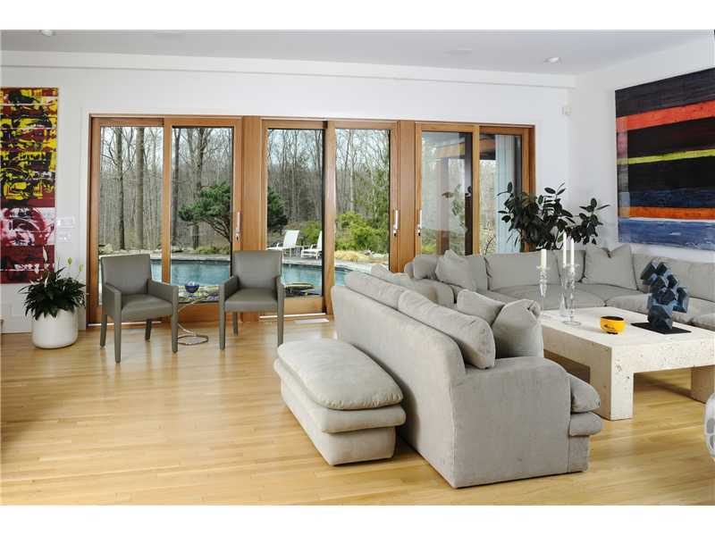 21 Mountain Wood Drive Greenwich, CT 06830 - Photo 4 of 20 a living room with furniture and a flat screen tv