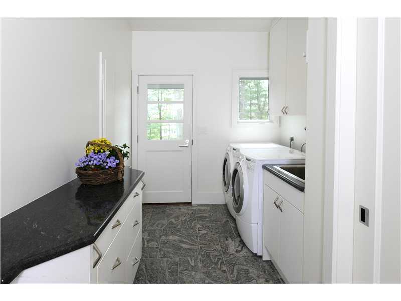 21 Mountain Wood Drive Greenwich, CT 06830 - Photo 9 of 20 a kitchen with a sink and a stove top oven