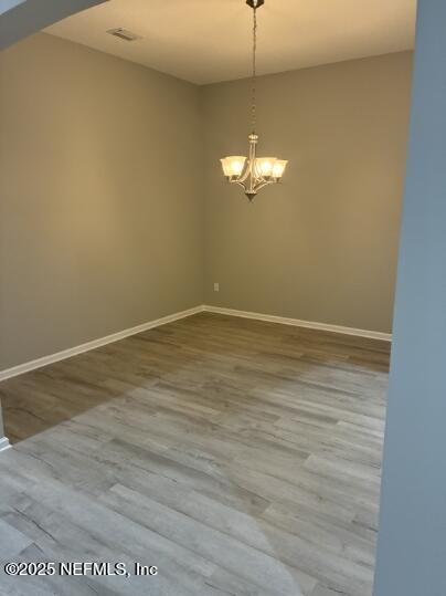 86192 Fortune Drive Yulee, FL 32097 - Photo 21 of 33 a view of empty room with wooden floor