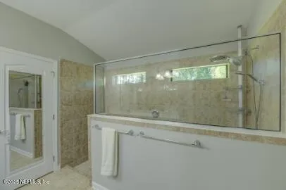a bathroom with a double vanity sink and a mirror