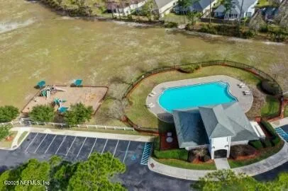 an aerial view of a house with a swimming pool