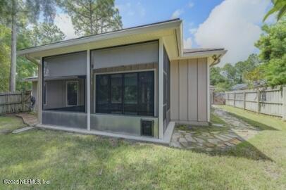 86192 Fortune Drive Yulee, FL 32097 - Photo 9 of 33 a view of backyard with small cabin