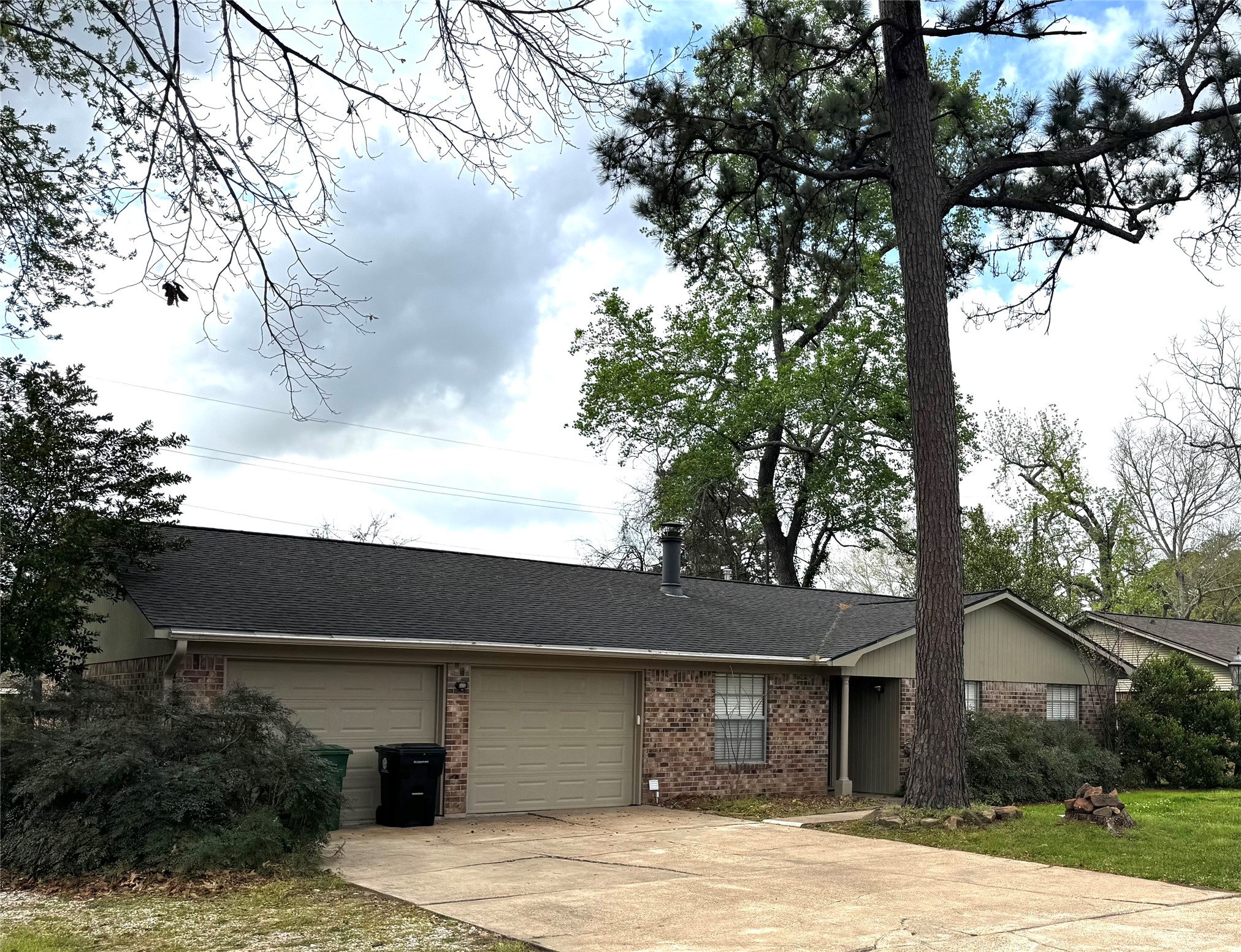 24231 Shellbrook Drive Houston, TX 77336 - Photo 1 of 42 a front view of a house with yard and trees