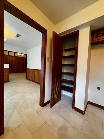 a kitchen with a stove and cabinets