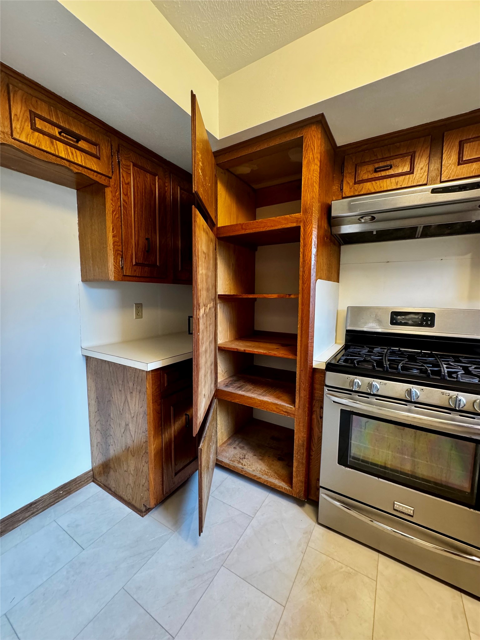24231 Shellbrook Drive Houston, TX 77336 - Photo 12 of 42 a kitchen with a stove and cabinets