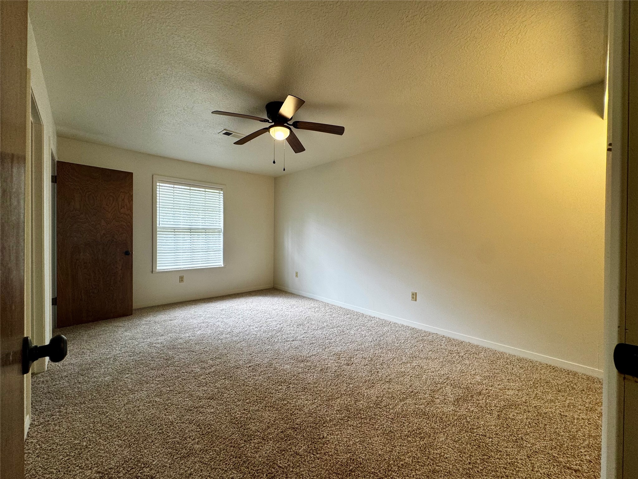 24231 Shellbrook Drive Houston, TX 77336 - Photo 14 of 42 an empty room with windows and ceiling fan