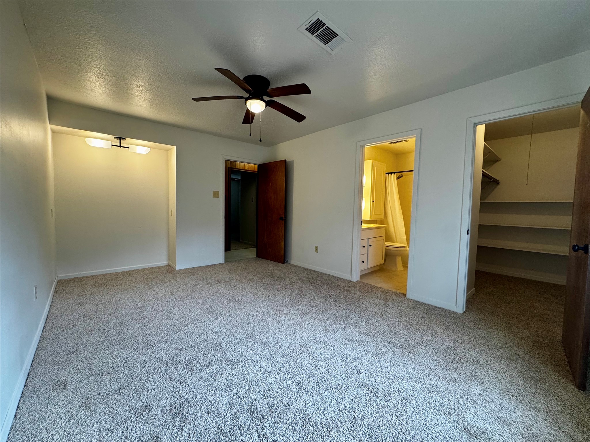 24231 Shellbrook Drive Houston, TX 77336 - Photo 16 of 42 a view of empty room with a ceiling fan and window