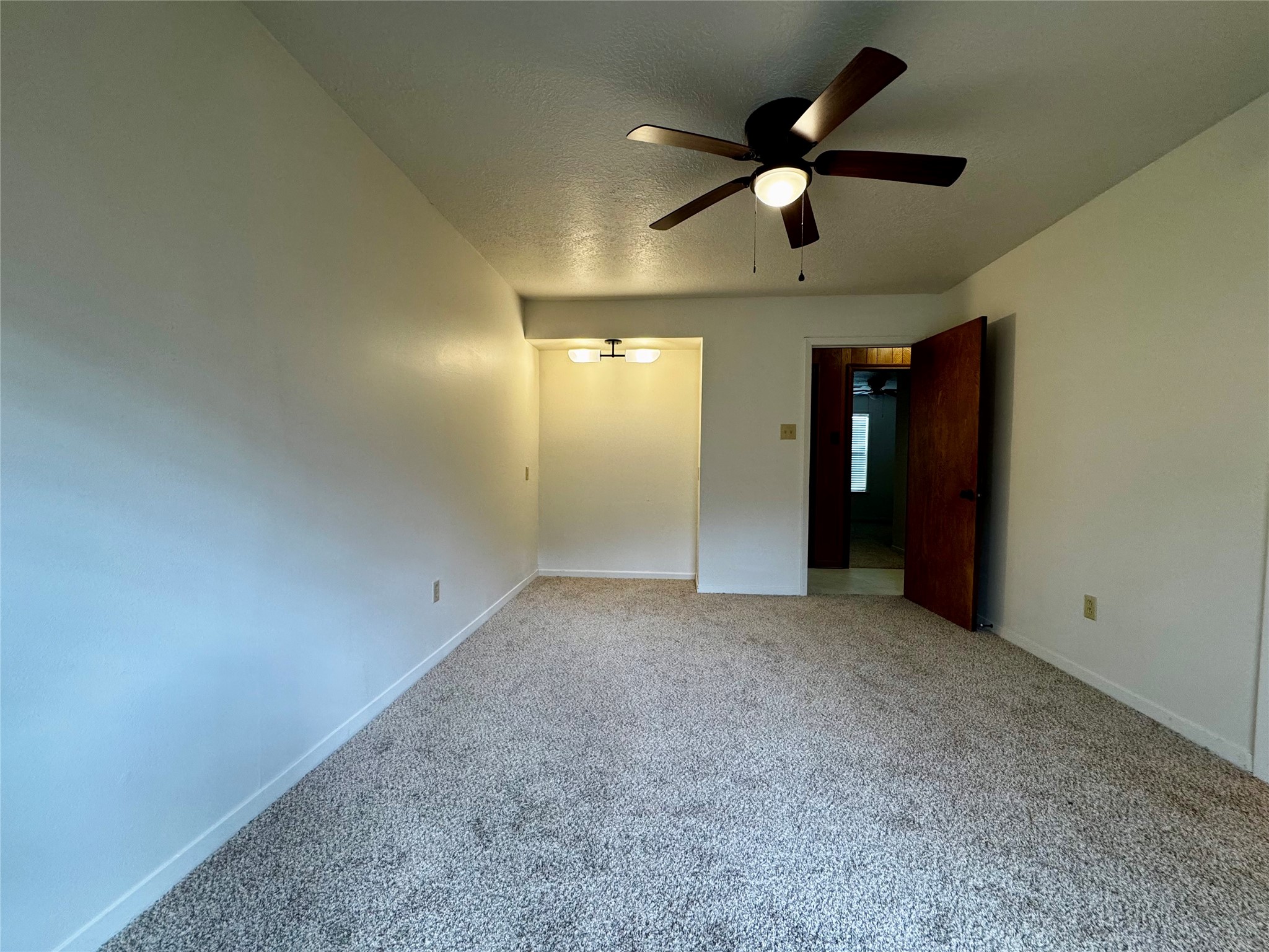 24231 Shellbrook Drive Houston, TX 77336 - Photo 18 of 42 an empty room with ceiling fan and window