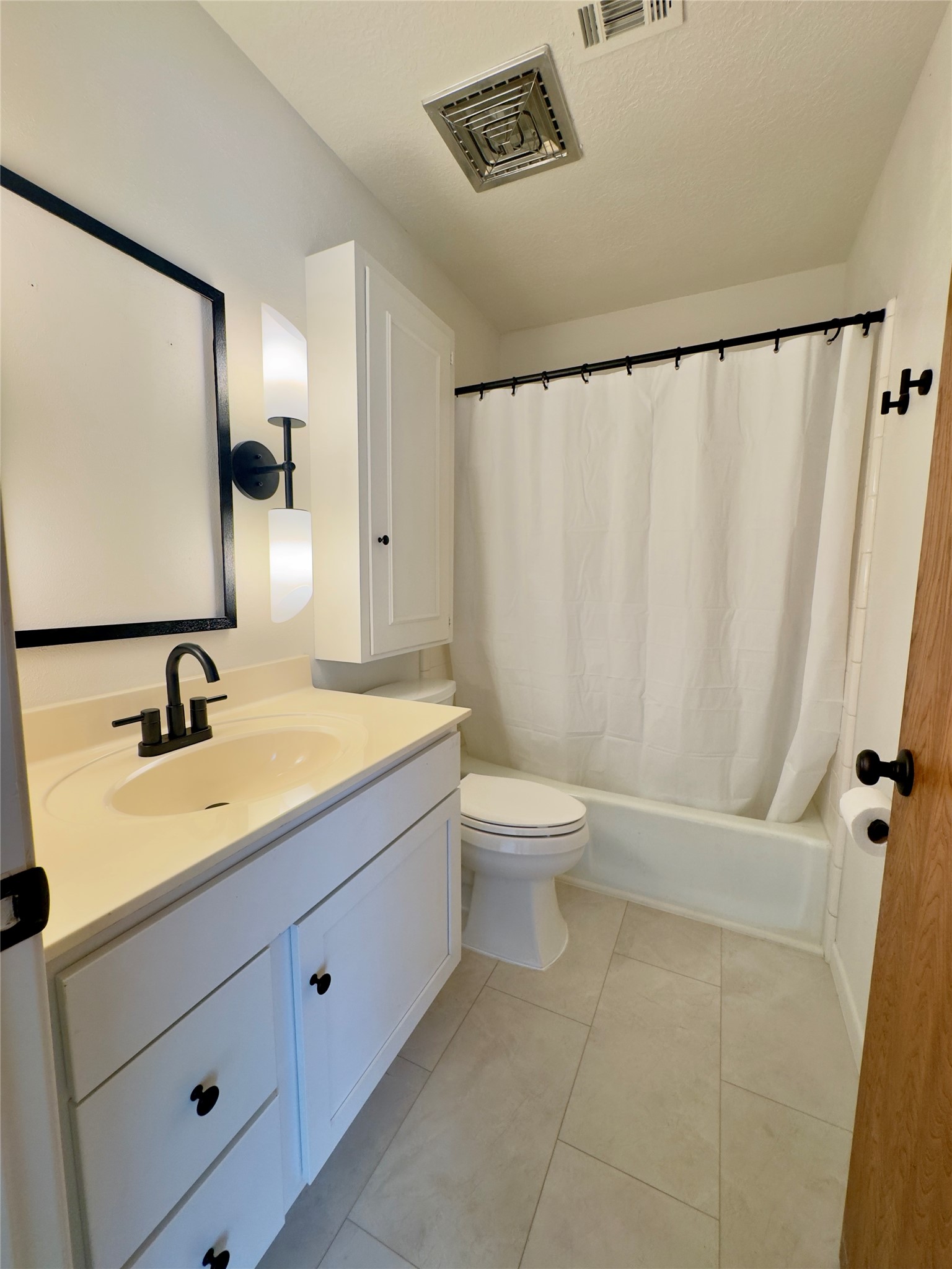 24231 Shellbrook Drive Houston, TX 77336 - Photo 20 of 42 a bathroom with a granite countertop sink toilet and shower
